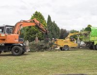 Digger feeding Chipper